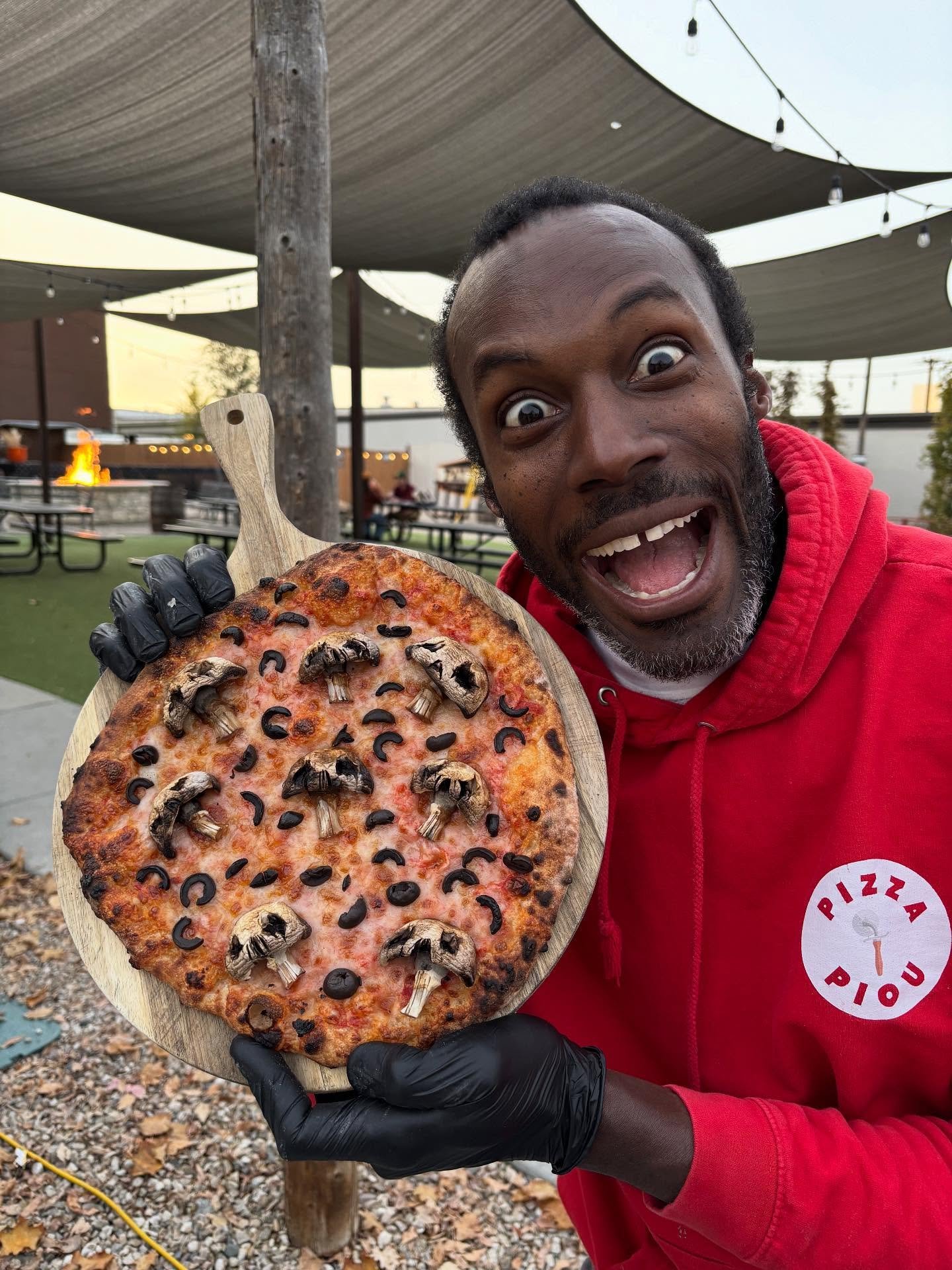 JP excited with mushroom olive pizza