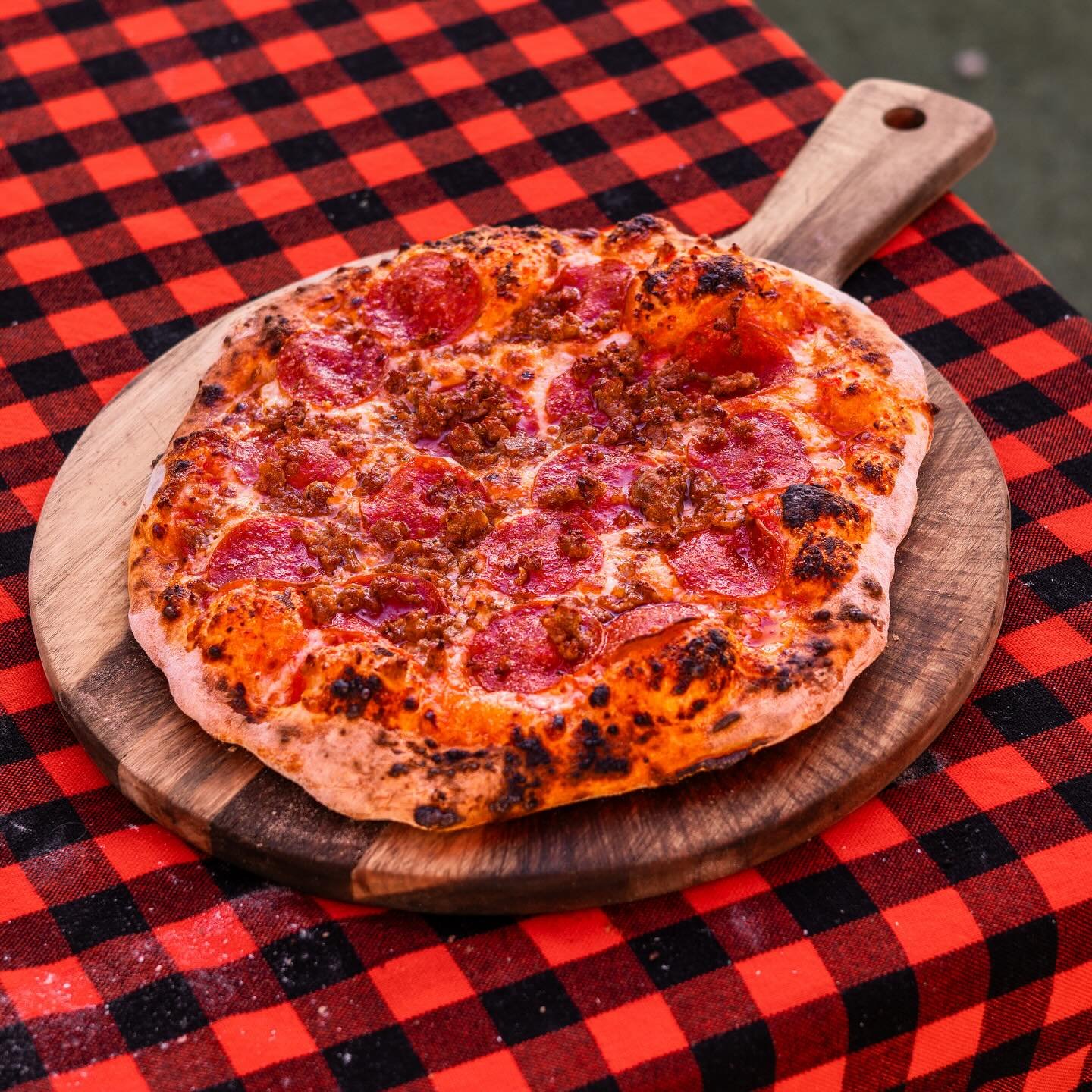 JP outdoor setup with stacked pizzas